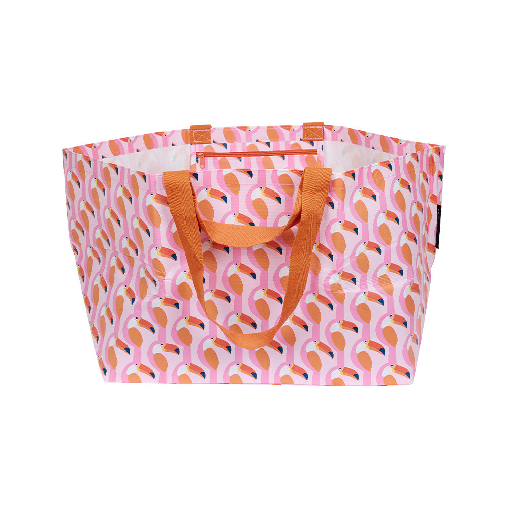 Extra large oversize beach bag made from strong and light recycled materials that can fold down to store and comes in a fun and bright print