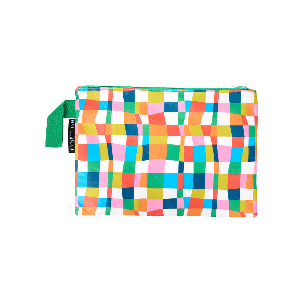 Large zip pouch made from recycled plastic materials in a colourful rainbow geometric print