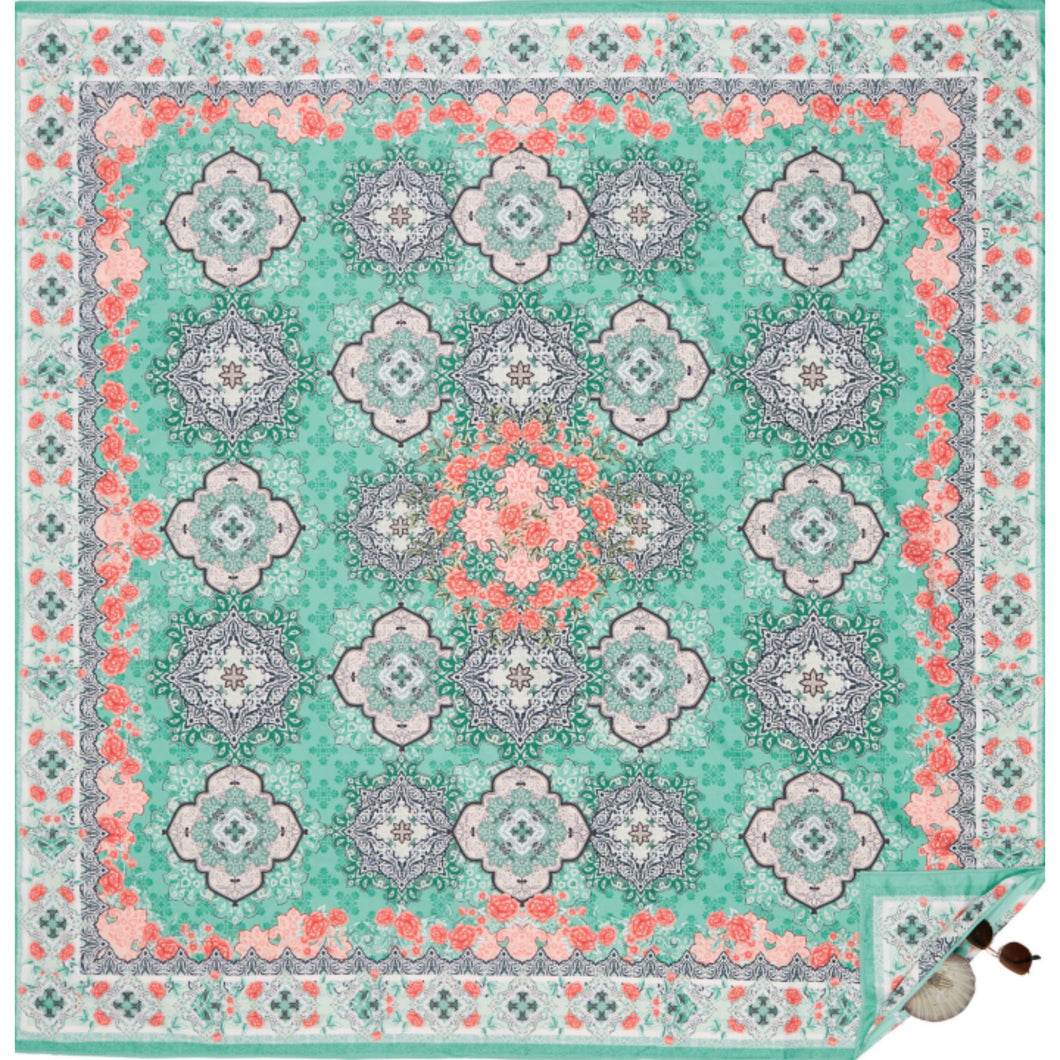 Beach mat that is sand free, lightweight, absorbent, fast drying and made from 85% recycled plastic bottles in Moroccan mint print