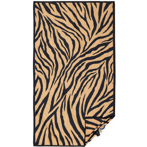 Beach towel that is sand free, lightweight, absorbent, fast drying and made from 85% recycled plastic bottles in tiger print